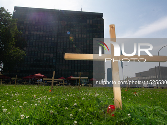 Crosses are placed in front of the headquarters of Thyssenkrupp industrial area in Duisburg, Germany, on August 29, 2024, as the IG Metall u...