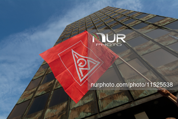 A general view of the IGM labor flag is seen in front of the Thyssenkrupp headquarters as a thousand steel workers stand in front of the gat...