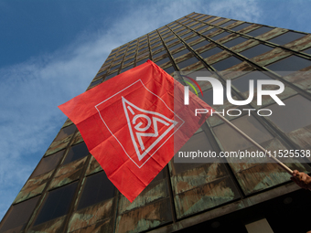 A general view of the IGM labor flag is seen in front of the Thyssenkrupp headquarters as a thousand steel workers stand in front of the gat...