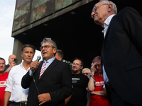 Sigmar Gabriel, the head of the supervisory board, speaks to the steelworkers after the press conference as a thousand steelworkers stand in...