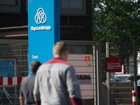 A thousand steel workers stand in front of the gate of the Thyssenkrupp industrial area in Duisburg, Germany, on August 29, 2024, as the IG...