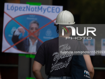 A thousand steel workers stand in front of the gate of the Thyssenkrupp industrial area in Duisburg, Germany, on August 29, 2024, as the IG...