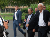 Sigmar Gabriel, the head of the supervisory board, comes toward the press conference site as a thousand steel workers stand in front of the...