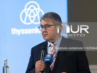 Sigmar Gabriel, the head of the supervisory board, speaks to the media about his resignation during a press conference as a thousand steel w...