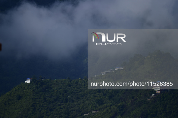 A cloudy view of Bosan Hill is seen from Kirtipur before incessant rainfall in Kathmandu, Nepal, on August 29, 2024. 