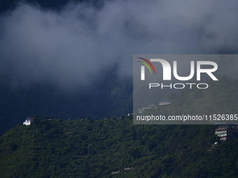 A cloudy view of Bosan Hill is seen from Kirtipur before incessant rainfall in Kathmandu, Nepal, on August 29, 2024. (