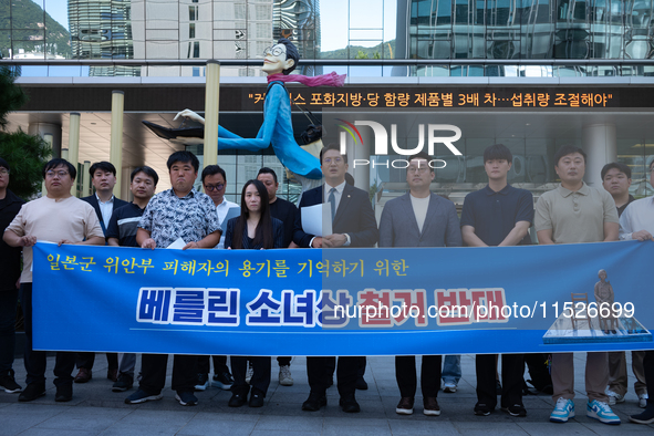 Democratic Party Youth Committee members, along with Rep. Jeon Yong-gi (center), gather in front of the Yonhap News Agency building in Seoul...