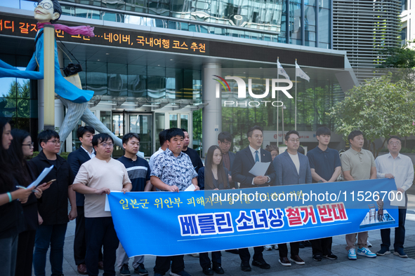 Democratic Party Youth Committee members, along with Rep. Jeon Yong-gi (center), gather in front of the Yonhap News Agency building in Seoul...