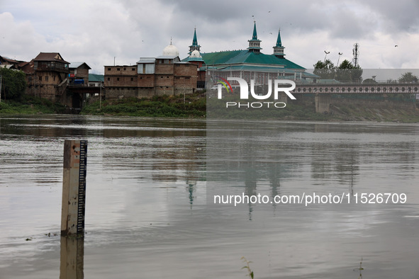 A measuring scale to check the water level is installed in the river Jhelum in Sopore, Jammu and Kashmir, India, on August 30, 2024. 