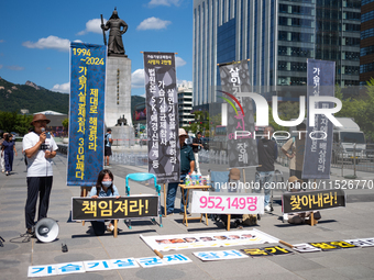 Citizen groups hold a press conference at Gwanghwamun Square in Seoul, South Korea, on August 30, 2024. Thirteen years after the humidifier...