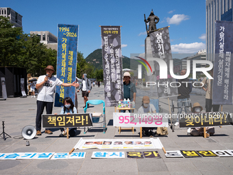 Citizen groups hold a press conference at Gwanghwamun Square in Seoul, South Korea, on August 30, 2024. Thirteen years after the humidifier...