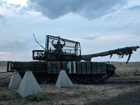 A tanker of the 118th Separate Mechanized Brigade poses for a photo on a T-72 tank before the start of the night firing exercise in the Zapo...