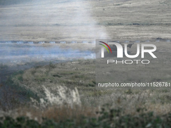 Tankers of the 118th Separate Mechanized Brigade drive a T-72 tank during the live-fire exercise in the Zaporizhzhia sector, Zaporizhzhia re...