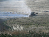 Tankers of the 118th Separate Mechanized Brigade drive a T-72 tank during the live-fire exercise in the Zaporizhzhia sector, Zaporizhzhia re...