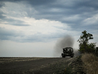 Tankers of the 118th Separate Mechanized Brigade are seen on the T-72 tank before the start of the night firing exercise in the Zaporizhzhia...