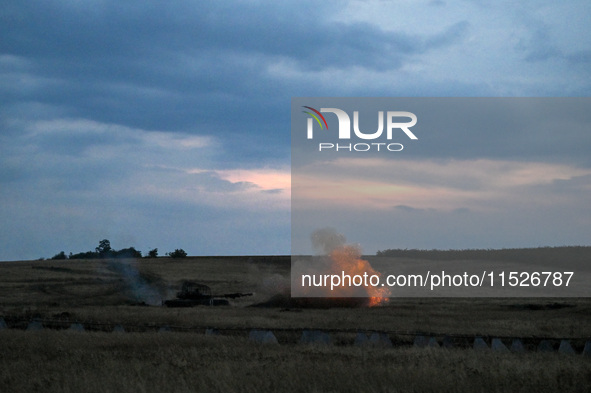 Tankers of the 118th Separate Mechanized Brigade are seen during the night firing exercise in the Zaporizhzhia sector in the Zaporizhzhia re...