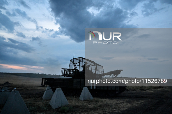 Tankers of the 118th Separate Mechanized Brigade are seen during the night firing exercise in the Zaporizhzhia sector in the Zaporizhzhia re...