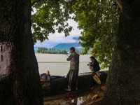 Kashmiris catch fish on the banks of Dal Lake in Srinagar, Jammu and Kashmir, on August 30, 2024. (