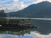 A Kashmiri man fishes on the banks of Dal Lake in Srinagar, Jammu and Kashmir, on August 30, 2024. (