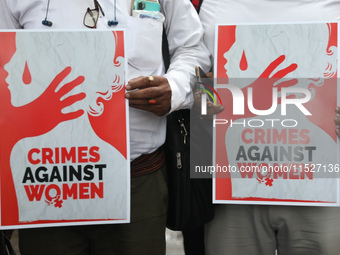 Government Sponsored Multipurpose School Taki House for Boys of Ex-Students and Ex-Teachers take part in a protest march in Kolkata, India,...