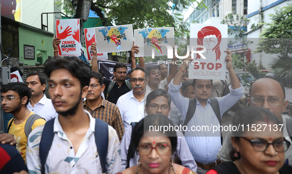 Government Sponsored Multipurpose School Taki House for Boys of Ex-Students and Ex-Teachers take part in a protest march in Kolkata, India,...