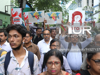 Government Sponsored Multipurpose School Taki House for Boys of Ex-Students and Ex-Teachers take part in a protest march in Kolkata, India,...