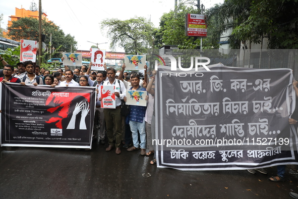 Government Sponsored Multipurpose School Taki House for Boys of Ex-Students and Ex-Teachers take part in a protest march in Kolkata, India,...