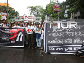 Government Sponsored Multipurpose School Taki House for Boys of Ex-Students and Ex-Teachers take part in a protest march in Kolkata, India,...