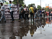 Government Sponsored Multipurpose School Taki House for Boys of Ex-Students and Ex-Teachers take part in a protest march in Kolkata, India,...