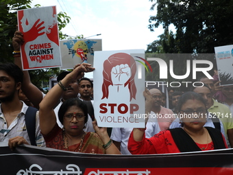 Government Sponsored Multipurpose School Taki House for Boys of Ex-Students and Ex-Teachers take part in a protest march in Kolkata, India,...