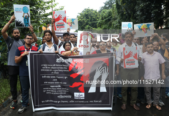 Government Sponsored Multipurpose School Taki House for Boys of Ex-Students and Ex-Teachers take part in a protest march in Kolkata, India,...