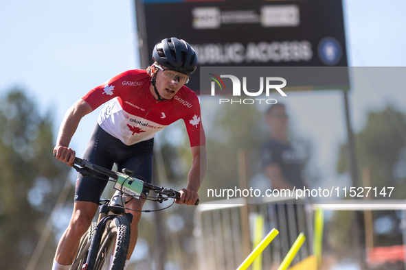 Julien Leclair of Canada participates in the UCI Mountain Bike World Championships Cross-Country Olympic Men Junior in Pal Arinsal, Andorra,...