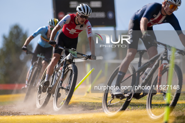 A cyclist participates in the UCI Mountain Bike World Championships Cross-Country Olympic Men Junior in Pal Arinsal, Andorra, on August 30,...