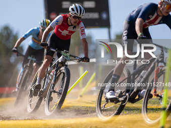 A cyclist participates in the UCI Mountain Bike World Championships Cross-Country Olympic Men Junior in Pal Arinsal, Andorra, on August 30,...