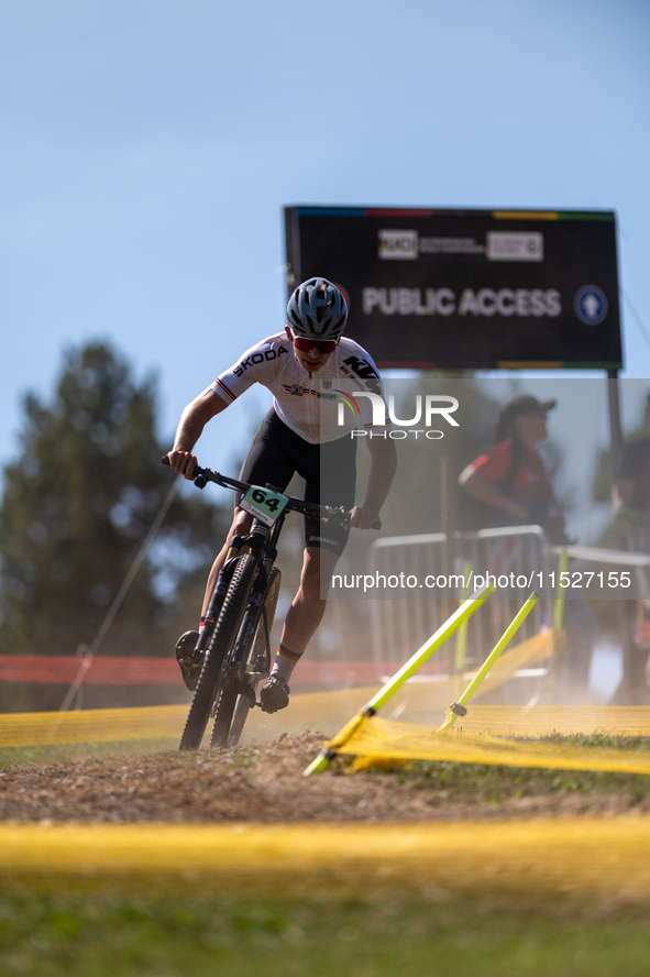 Ezra Adler of Germany participates in the UCI Mountain Bike World Championships Cross-Country Olympic Men Junior in Pal Arinsal, Andorra, on...