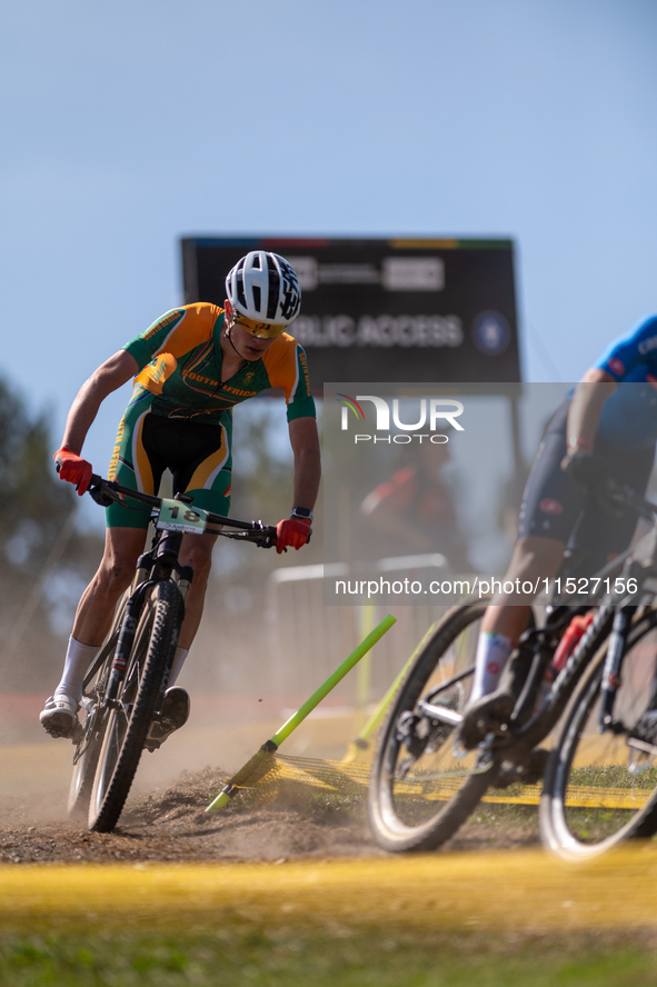 A cyclist participates in the UCI Mountain Bike World Championships Cross-Country Olympic Men Junior in Pal Arinsal, Andorra, on August 30,...