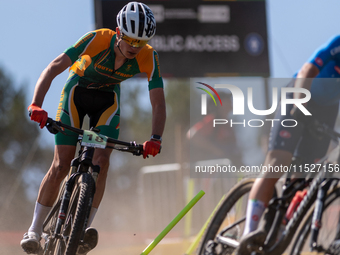 A cyclist participates in the UCI Mountain Bike World Championships Cross-Country Olympic Men Junior in Pal Arinsal, Andorra, on August 30,...