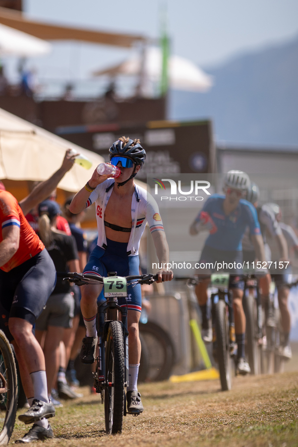 A cyclist participates in the UCI Mountain Bike World Championships Cross-Country Olympic Men Junior in Pal Arinsal, Andorra, on August 30,...