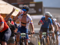 A cyclist participates in the UCI Mountain Bike World Championships Cross-Country Olympic Men Junior in Pal Arinsal, Andorra, on August 30,...