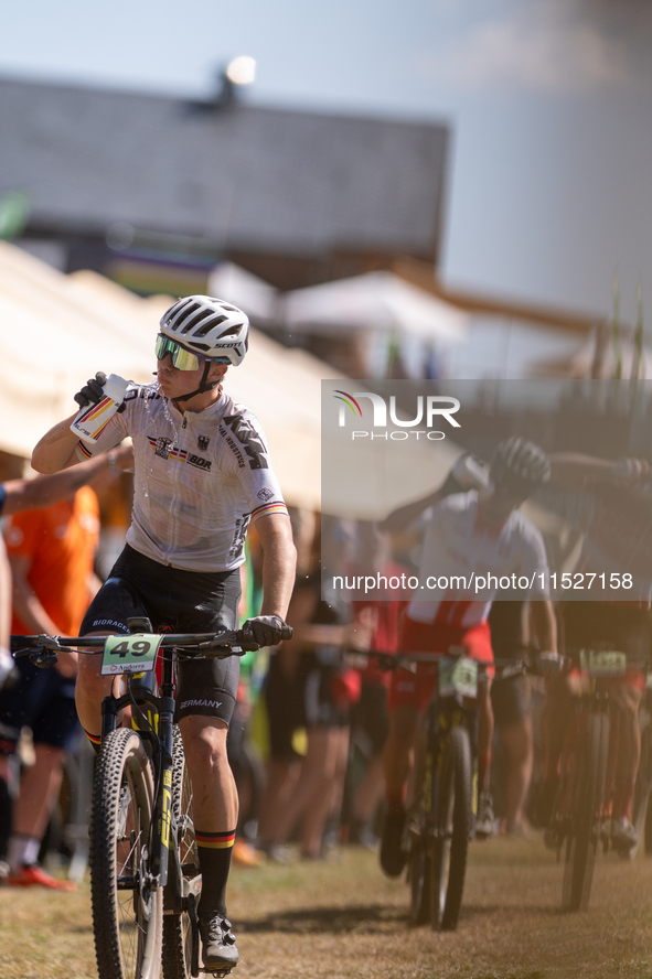 A cyclist participates in the UCI Mountain Bike World Championships Cross-Country Olympic Men Junior in Pal Arinsal, Andorra, on August 30,...