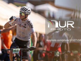 A cyclist participates in the UCI Mountain Bike World Championships Cross-Country Olympic Men Junior in Pal Arinsal, Andorra, on August 30,...