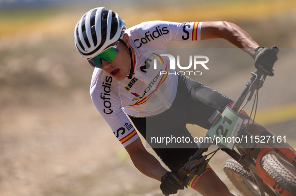 Alberto Garcia of Spain participates in the UCI Mountain Bike World Championships Cross-Country Olympic Men Junior in Pal Arinsal, Andorra,...