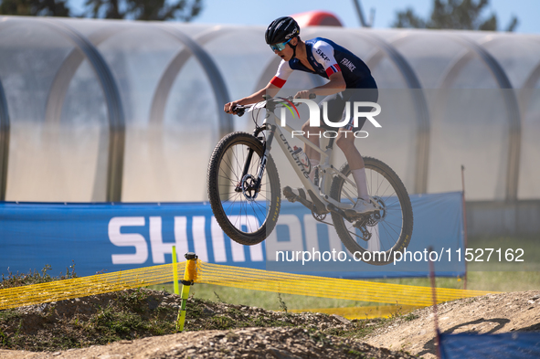 A cyclist participates in the UCI Mountain Bike World Championships Cross-Country Olympic Men Junior in Pal Arinsal, Andorra, on August 30,...