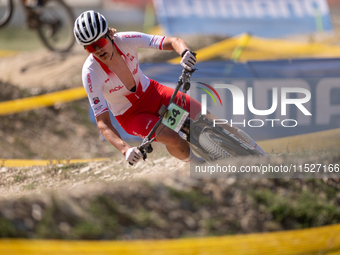 Hector Jaroslawski of Poland competes in the UCI Mountain Bike World Championships Cross-Country Olympic Men Junior in Pal Arinsal, Andorra,...