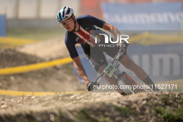 Mikhail Mosteller of UNITED competes in the UCI Mountain Bike World Championships Cross-Country Olympic Men Junior in Pal Arinsal, Andorra,...