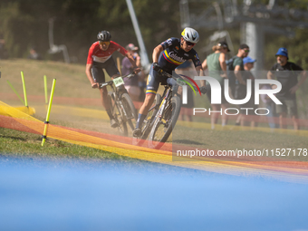 A cyclist participates in the UCI Mountain Bike World Championships Cross-Country Olympic Men Junior in Pal Arinsal, Andorra, on August 30,...