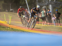 A cyclist participates in the UCI Mountain Bike World Championships Cross-Country Olympic Men Junior in Pal Arinsal, Andorra, on August 30,...