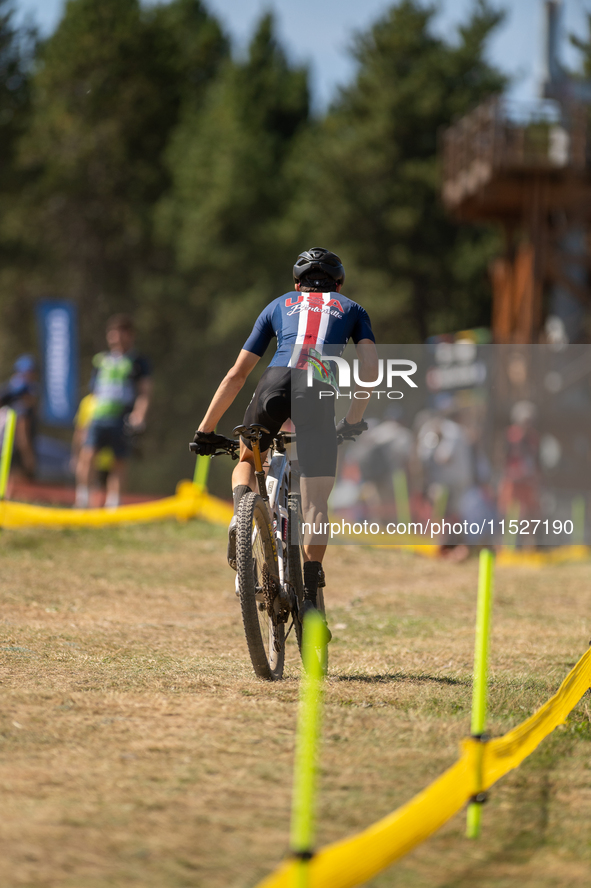 A cyclist participates in the UCI Mountain Bike World Championships Cross-Country Olympic Men Junior in Pal Arinsal, Andorra, on August 30,...