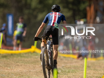 A cyclist participates in the UCI Mountain Bike World Championships Cross-Country Olympic Men Junior in Pal Arinsal, Andorra, on August 30,...