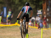 A cyclist participates in the UCI Mountain Bike World Championships Cross-Country Olympic Men Junior in Pal Arinsal, Andorra, on August 30,...